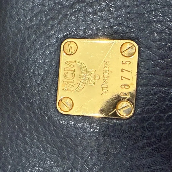 MCM Black Leather Backpack with Gold Accents - Picture 12 of 15